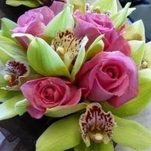 Green cymbidiums and hot pink roses bouquet
