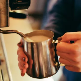 a bari serving a cup of coffee