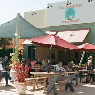 Outdoor seating with sun shade.