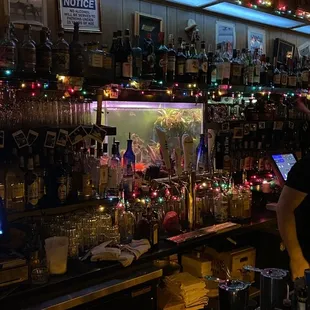 a woman standing at the bar
