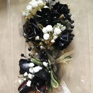 Coursage and boutineer painted black with gold ribbon. Just what they wanted!