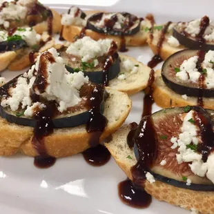 Fig and Goat Cheese Crostini with Cranberry Balsamic Reduction
