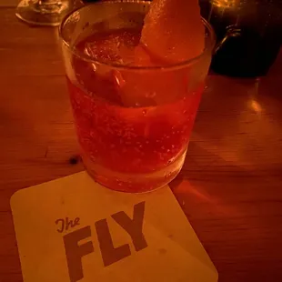 a drink in a glass on a table