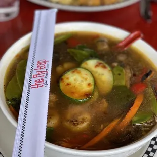 a bowl of soup with a spoon in it