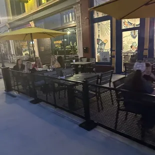 a group of people sitting at tables