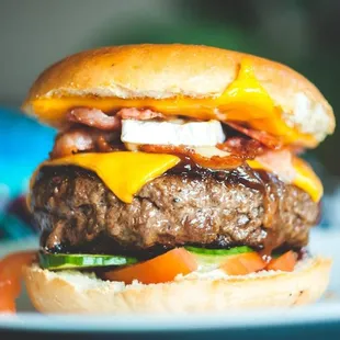a hamburger with cheese and bacon
