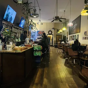 people sitting at tables in a restaurant