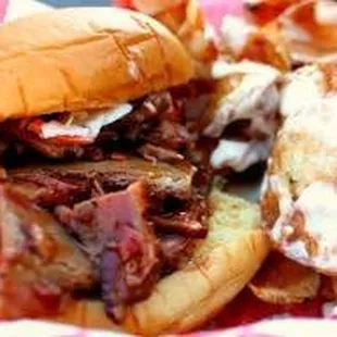 a pulled pork sandwich and fries