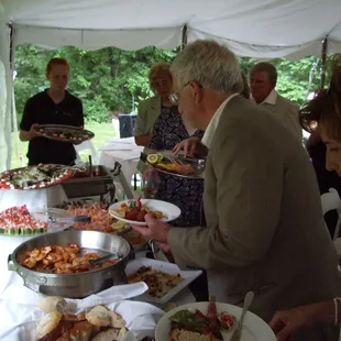 Outdoor wedding reception hosted in the clients own backyard.