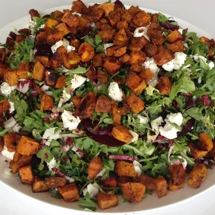 Our roasted butternut squash and beet salad over hearty winter greens with chèvre, pinenuts and pomegranate vinaigrette.