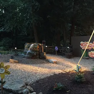 a fire hydrant in the middle of the garden