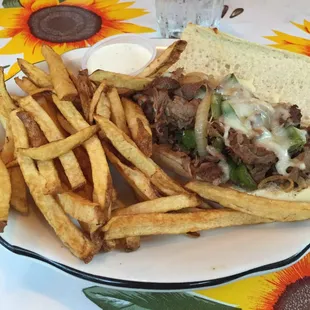 Steak and cheese sub with onions and peppers (half size). It was so good I wished I had ordered the whole!