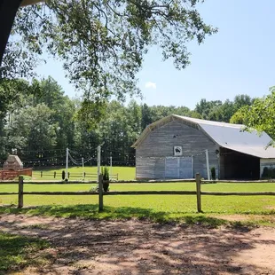 Outside the Barn at Forevermore Farm. To the left is a deck with  an outside fireplace.