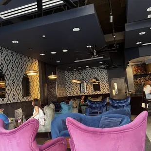 a woman sitting in a lounge area