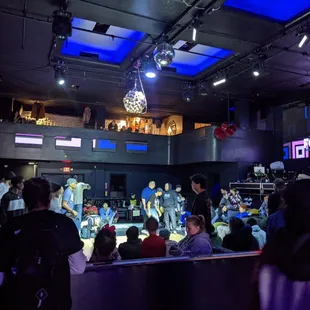 a group of people in a large room