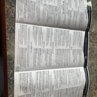a close up of a menu on a table