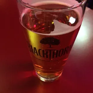 a glass of beer on a table