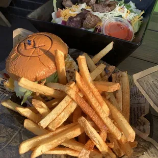 Burger with egg and bacon and fresh cut fries