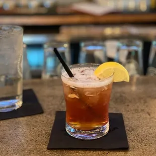 a drink with a slice of lemon