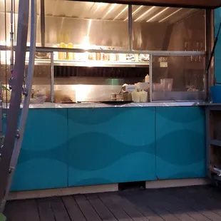 an outdoor kitchen in the evening
