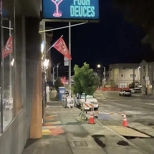 a neon sign on the side of a building