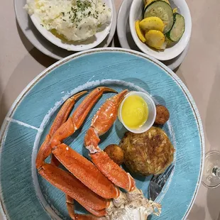 Crab legs, crab cake, garlic mashed potatoes and squash.
