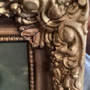 The 3rd corner more cracks and pieces of the frame missing, horrible.