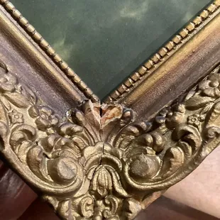 Several huge pieces of the frame missing and cracks every where.