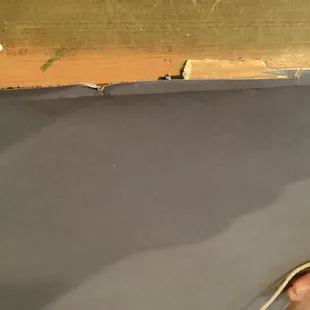 More old paper just under the slightly tacky paper. Horrible job.