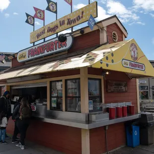 people standing in front of a restaurant