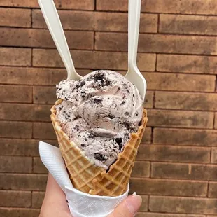 Single scoop in a waffle cone - cookies and cream made with hydrox cookie instead of Oreos!