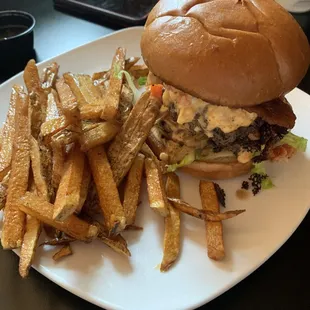Franklin Inn's "Smash It All The Way" burger with bacon, fried onions, pickled jalapenos and pimento cheese.