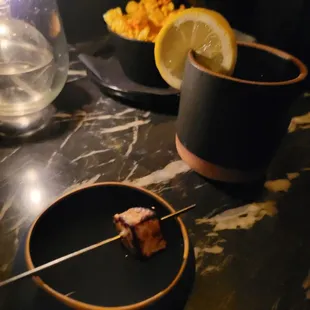 a small skewer of meat on a stick