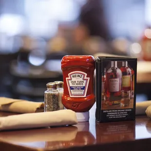 a ketchup bottle, salt and pepper shaker