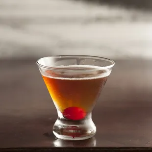 a glass of beer on a table