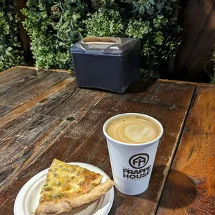 a slice of pizza and a cup of coffee