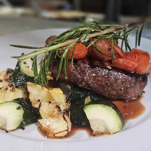 a plate of meat and vegetables