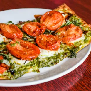 a slice of pizza on a plate