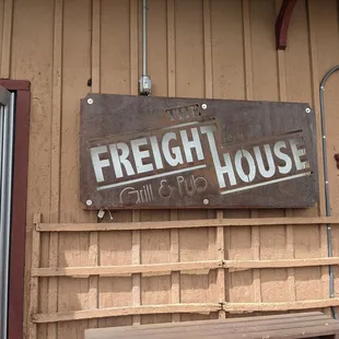 Signage by front door.