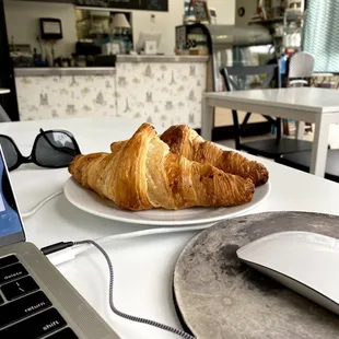 The most flaky authentic croissants I&apos;ve ever tasted enjoyed whilst working at one of the cute tables