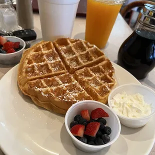 Waffle with fresh berries and freshly squeezed Orange juice