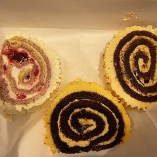 three rolls of cake in a box