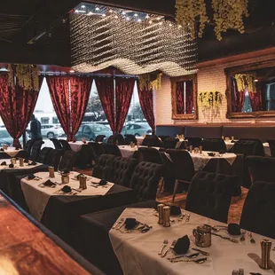 a dining room with tables and chairs