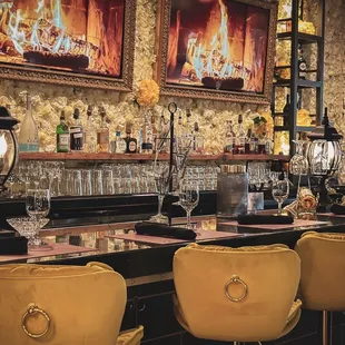 a bar with yellow chairs