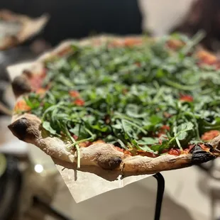 Arugula topped Chili Pizza.  A tad spicy for me the kick comes at the end.