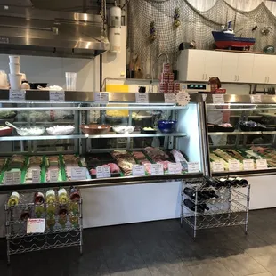 a variety of foods in a display case