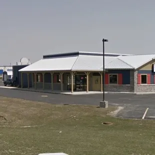 an empty parking lot and a building