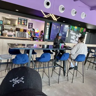 High top seating and tons of cushy banquette seating here!