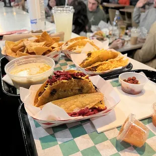 Brisket, chicken and pork with white queso and chips