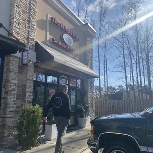 a man walking down the sidewalk